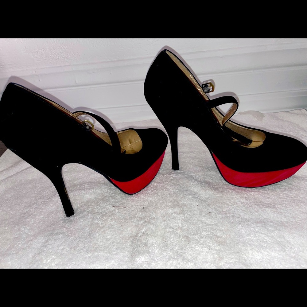Slightly used size 10 women’s Black suede heel .